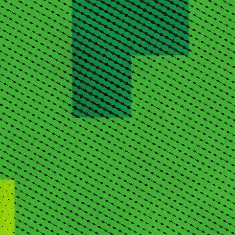 Pontos de tinta da estampa X Pixelado Verde sobre o algodão, vistos de perto